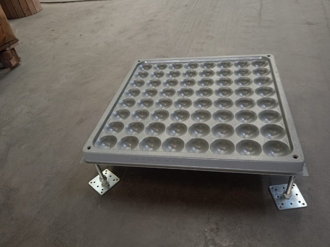 Raised Access Floor Tile with Adjustable Pedestal Stands (Category: Construction & Building Materials) located in Muntinlupa City. Submitted by fast_bryantorrentefernand (Listing ID 1470612130, Image 3). Description: - 1 Set - Type: Heavy-duty raised floor panel with grey top surface - Drainage/Airflow: Features dimpled underside for optimal ventilation and water flow - Support: Includes 4 adjustable metal threaded pedestal legs with base plates 