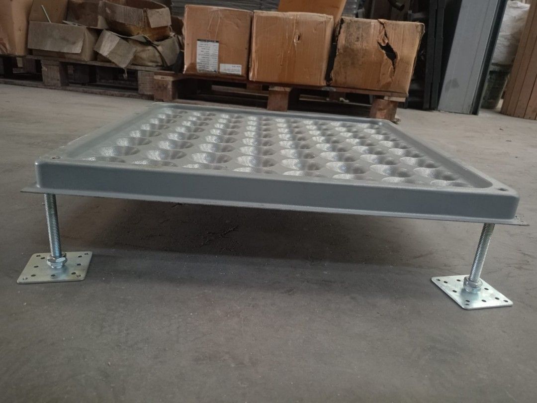 Raised Access Floor Tile with Adjustable Pedestal Stands (Category: Construction & Building Materials) located in Muntinlupa City. Submitted by fast_bryantorrentefernand (Listing ID 1470612130, Image 2). Description: - 1 Set - Type: Heavy-duty raised floor panel with grey top surface - Drainage/Airflow: Features dimpled underside for optimal ventilation and water flow - Support: Includes 4 adjustable metal threaded pedestal legs with base plates 