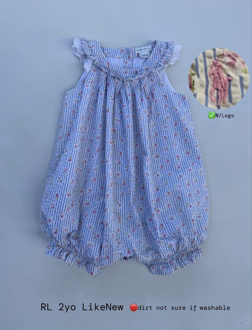 Ralph Lauren Blue Striped Floral Bubble Romper (Category: Babies & Kids Fashion) located in Pozorrubio. Submitted by izaykite2g (Listing ID 1470680871, Image 1). Description: - Brand: Ralph Lauren - Size: Fits a 2-year-old - Design: Blue and white stripes with tiny pink flowers - Details: Ruffle collar with white eyelet trim, pink embroidered chest logo, elastic legs with ruffle hems - Flaw: Small dirt spot near the bottom (unsure if removable) -