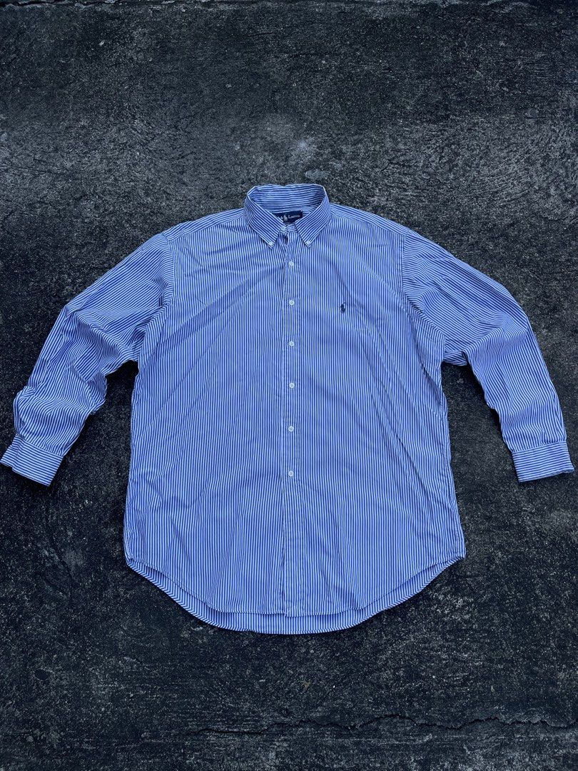 Ralph Lauren Classic Fit Striped Button-Down Shirt (Category: Tshirts & Polo Shirts ) located in Tarlac. Submitted by supremo.0 (Listing ID 1470563524, Image 1). Description: - Brand: Ralph Lauren - Color/Pattern: Blue and white striped - Fit: Classic fit - Size: 16 1/2 (26.5x 32) - Details: Button-down collar, front placket, long sleeves with buttoned cuffs, embroidered pony logo - Care: Machine wash warm - Origin: Made in Hong Kong.