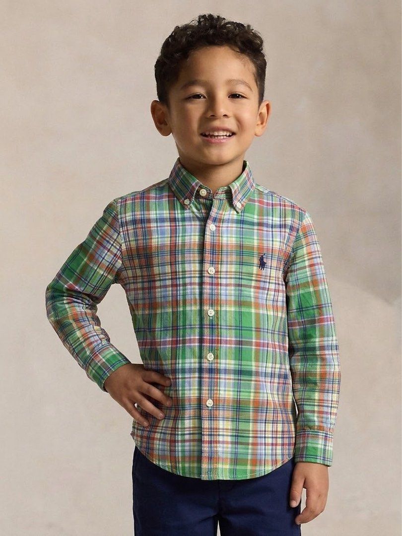 Ralph Lauren Plaid Button-Down Shirt Size 7 (Category: Babies & Kids Fashion) located in Ajuy. Submitted by galitsabarat (Listing ID 1470615137, Image 2). Description: - Brand: Ralph Lauren - Item: Boys button-down shirt - Design: Green plaid with blue, orange, and white accents - Size: 7 (130/64) - Details: Classic collar, long sleeves, front button closure, signature embroidered pony logo - Condition: Clean, excellent, and ready to wear.