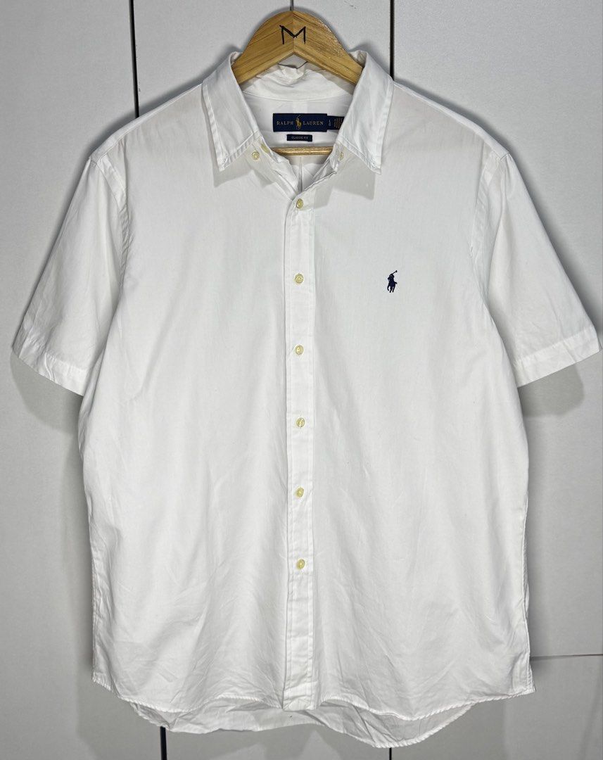 Ralph Lauren short sleeves (Category: Formal Shirts) located in Subic. Submitted by notstyl (Listing ID 1470707303, Image 1). Description: RL white navy blue pony 24 x 29/30 (Large/Classic fit) Excellent condition.