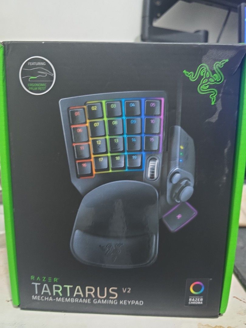 Razer Tartarus V2 Mecha-Membrane Gaming Keypad (Category: Computer Keyboard) located in Manila. Submitted by j_carlo_c (Listing ID 1470624989, Image 1). Description: - Item: Razer Tartarus V2 Gaming Keypad - Condition: Excellent, comes with original packaging - Features: 32 fully programmable keys, 8-way directional thumbpad, and scroll wheel - Comfort: Includes detachable ergonomic palm rest for long gaming sessions - Aesthetics: Customizable Ra