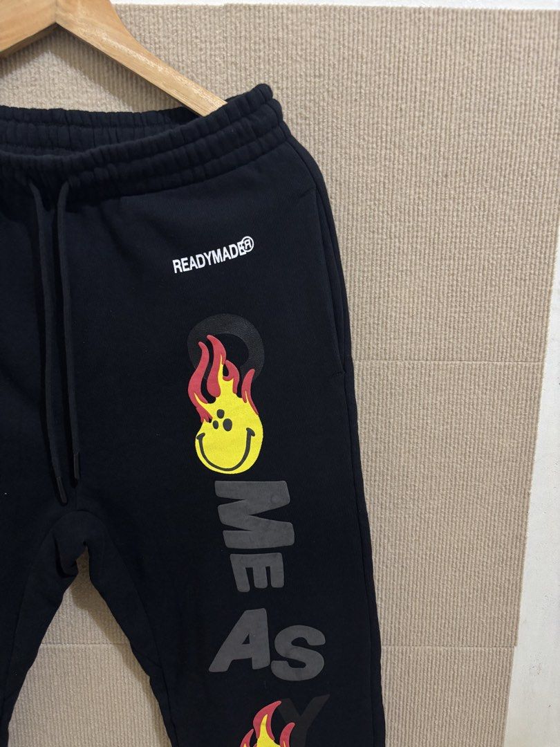 READYMADE Fire Smile Print Sweatpants (Category: Joggers) located in San Fernando. Submitted by jyyyshytt (Listing ID 1470688571, Image 2). Description: Excellent condition No issue Color rate:9.5/10 Dimensions:W30-34 L42 hem 6.