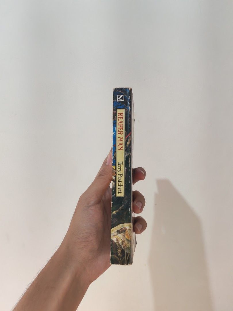 Reaper Man by Terry Pratchett - MMPB (Category: Storybooks) located in Batangas. Submitted by bebop_014 (Listing ID 1470632214, Image 2). Description: Decent condition. Spine creases. Tanned pages. Light foxing. Reaper Man, a Discworld Novel MMPB 📩 Message me for more details.