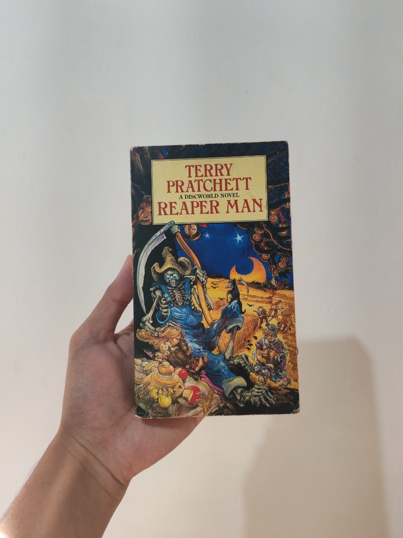 Reaper Man by Terry Pratchett - MMPB (Category: Storybooks) located in Batangas. Submitted by bebop_014 (Listing ID 1470632214, Image 1). Description: Decent condition. Spine creases. Tanned pages. Light foxing. Reaper Man, a Discworld Novel MMPB 📩 Message me for more details.