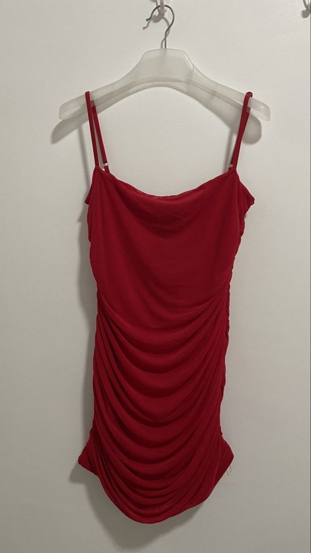 Red Ruched Bodycon Cami Dress (Category: Dresses) located in Indang. Submitted by itsginnpom (Listing ID 1470582941, Image 1). Description: Size: M-L Color: Bright red Style: Party dress / Clubwear with draped neckline Fit: Body-hugging with flattering front and side ruching Material: Soft, stretchy mesh fabric Details: Thin, adjustable spaghetti straps.