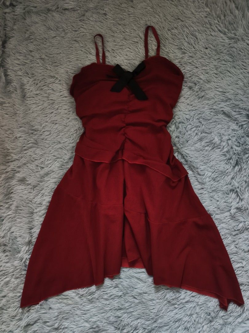 Red Spaghetti Strap Dress with Black Bow (Category: Dresses) located in Quezon City. Submitted by alluring.avenue (Listing ID 1470672120, Image 1). Description: - Vibrant red spaghetti strap dress - S-L - Fitted ruched bodice with a contrasting black bow accent - Flowing, asymmetrical layered hemline - Lightweight and comfortable fabric - Perfect for dates and casual nights out.
