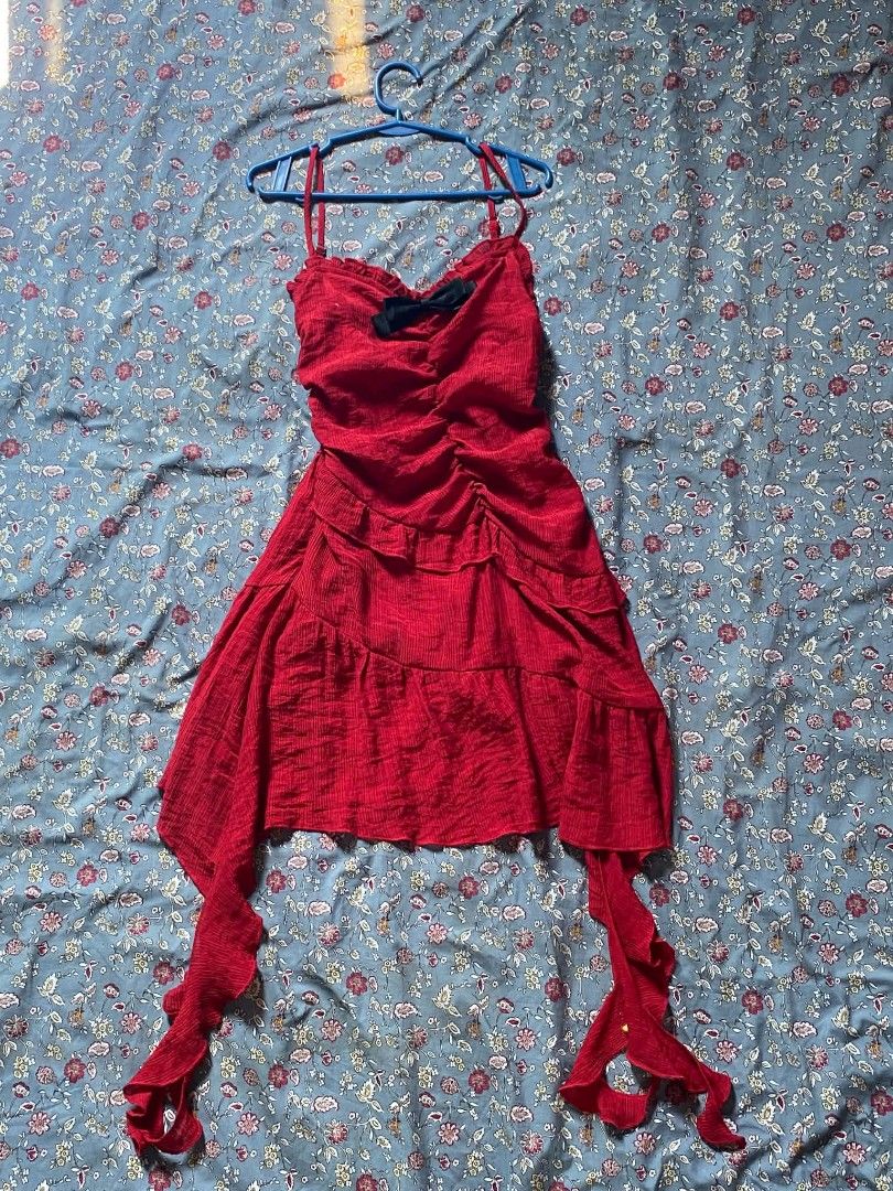 Red Spaghetti Strap Ruffle Dress with Black Bow (Category: Dresses) located in Tarlac. Submitted by fastdragon_d1826f (Listing ID 1470669356, Image 1). Description: - Color: Bright red - Design: Thin straps, ruffled tiers down the front, and cute black bow at the sweetheart neckline - Hemline: Asymmetrical with long dangling ribbon ties on both sides - Fabric: Textured material with a slight vertical stretch for a comfortable fit - Versatility: I