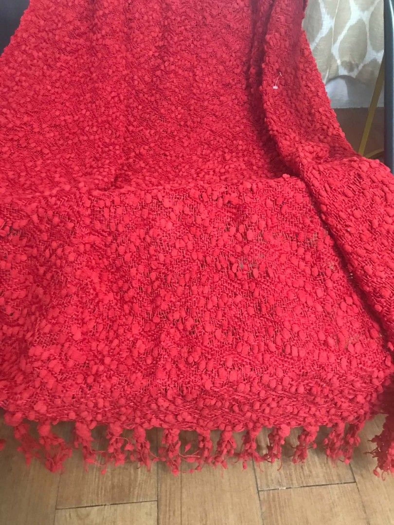Red Textured Throw Blanket With Fringe (Category: Bedding & Towels) located in Imus. Submitted by stop_shop7 (Listing ID 1470620901, Image 1). Description: - Color: Bright red - Design: Heavy texture with woven pattern and fringe detailing - Material: Cozy knit - Size: Standard throw size - Perfect for: Adding a pop of color to sofas or beds.