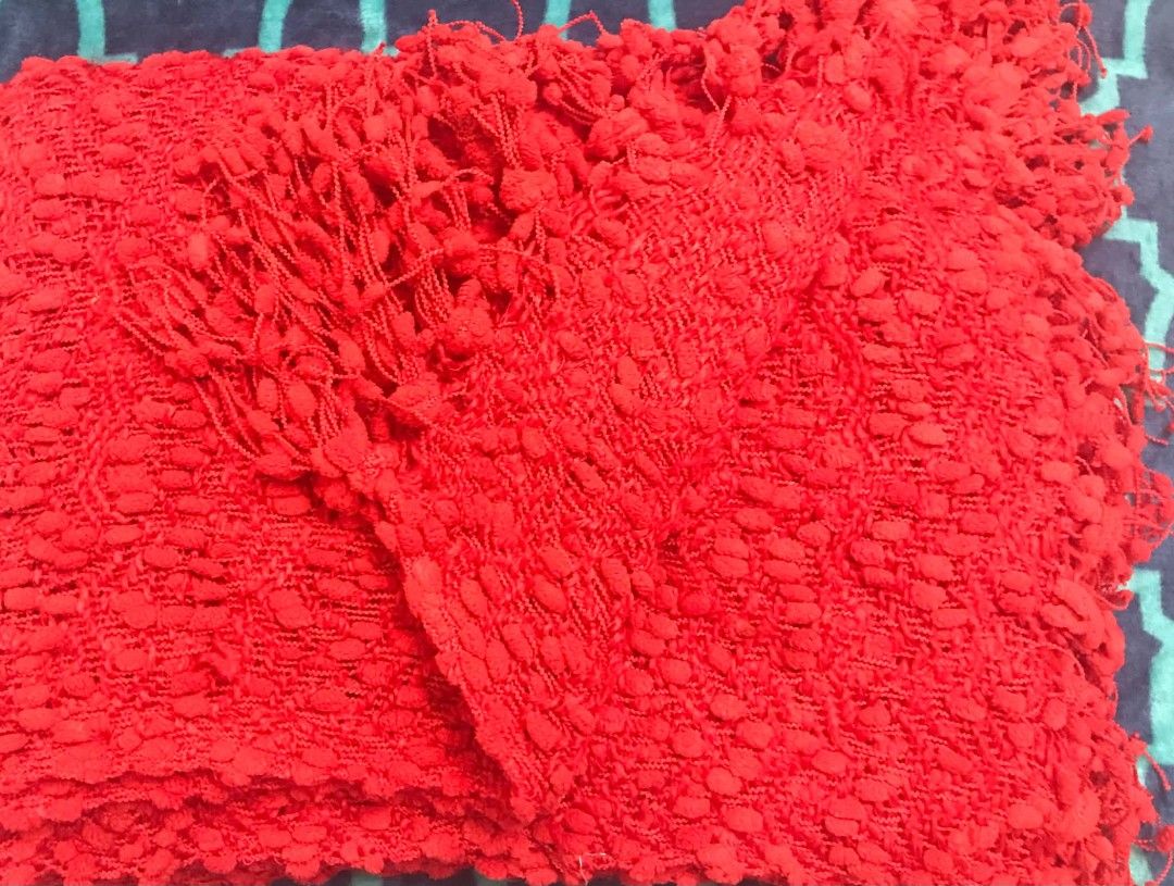 Red Textured Throw Blanket With Fringe (Category: Bedding & Towels) located in Imus. Submitted by stop_shop7 (Listing ID 1470620901, Image 2). Description: - Color: Bright red - Design: Heavy texture with woven pattern and fringe detailing - Material: Cozy knit - Size: Standard throw size - Perfect for: Adding a pop of color to sofas or beds.