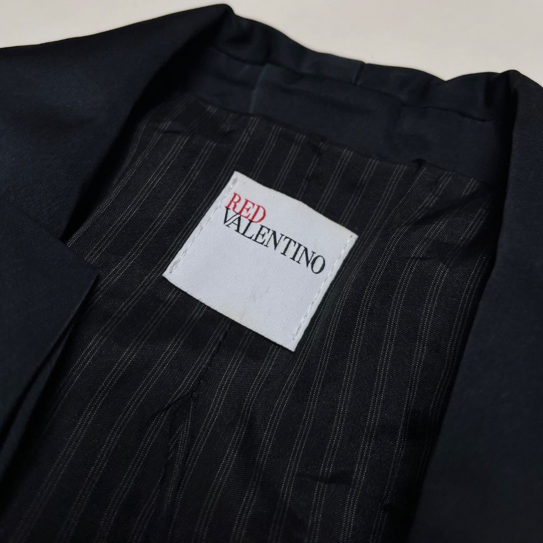 Red Valentino Black Bowtie Blazer (Category: Coats, Jackets and Outerwear) located in Caloocan City. Submitted by achilles_grails (Listing ID 1470675027, Image 3). Description: - Brand: Red Valentino - Color: Classic Black - Origin: Made in Italy - Material: 58% Cotton, 41% Virgin Wool, 1% Spandex (High-quality premium blend) - Features: Unique lapel bowtie design, chic striped inner lining, tailored fit - Condition: Excellent pre-loved condition