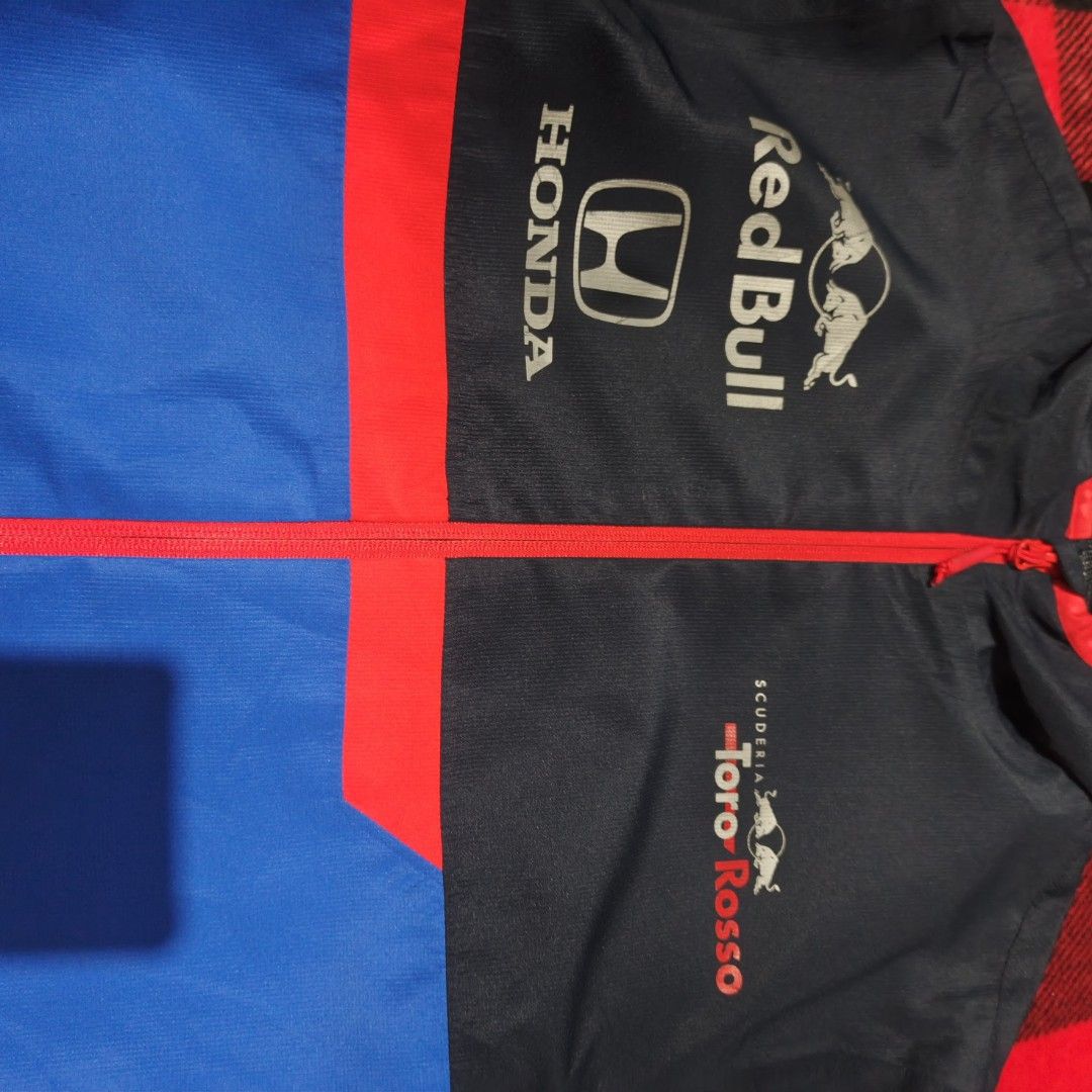 REDBULL F1 TORRO ROSSO TEAM RAIN JACKET (Category: Coats, Jackets and Outerwear) located in Subic. Submitted by racearchives_jep (Listing ID 1470580249, Image 3). Description: 21x28 minimal hairline.