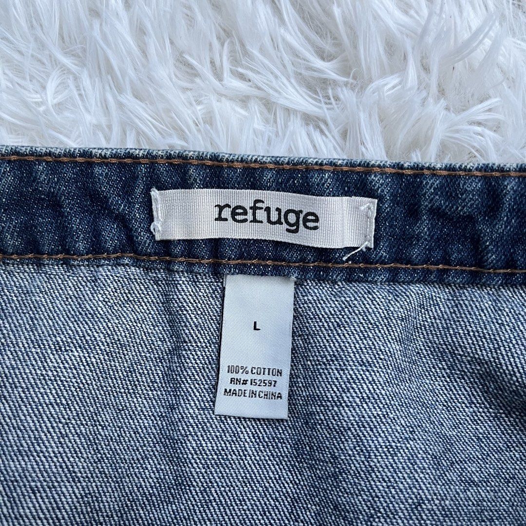 Refuge Denim Zip-Front Skirt Size L (Category: Skirts) located in Cuyapo. Submitted by Ashtyn.Pre.Loved (Listing ID 1470739934, Image 2). Description: - Brand: Refuge - Size: Large - Color/Wash: Dark wash denim - Material: 100% cotton - Closure: Full-length front metal zipper - Pockets: Two large front utility pockets - Origin: Made in China - Condition: Brand new with tag attached.