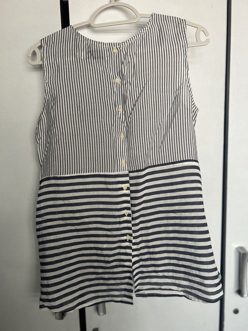 Regatta Striped Sleeveless Tie-Front Top with Back Buttons (Category: Sleeveless) located in Pasig City. Submitted by ladyleslieisletavelarde4902 (Listing ID 1470588238, Image 2). Description: Stylish navy and white striped sleeveless top featuring a combination of vertical and horizontal stripe panels Brand: Regatta Size: Extra Small (XS) Shipping c/o buyer.