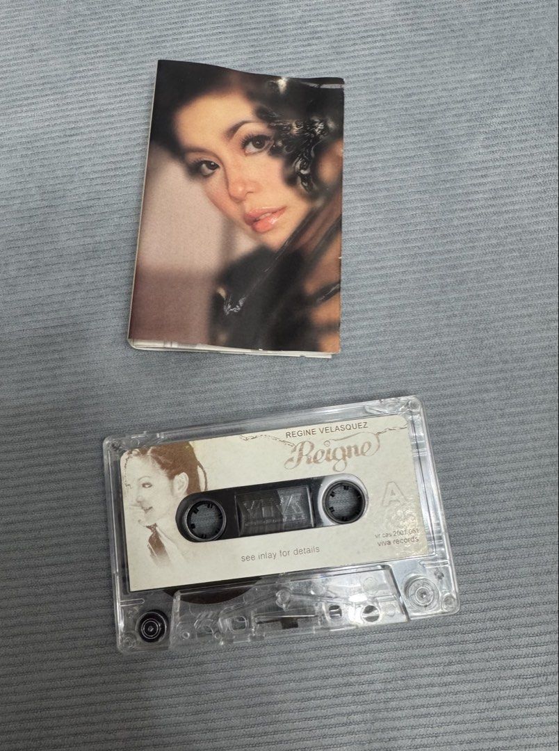 Regine Velasquez Reign Cassette Tape (Category: CDs & DVDs) located in Cavite. Submitted by ms.cdjunkies (Listing ID 1470720498, Image 1). Description: - Artist & Title: Regine Velasquez - Reign - Label: Viva Records (Catalog No: vr cas 2001 061) - Condition/Inclusions: Original cassette tape with inlay card booklet and clear plastic case - Perfect for: OPM collectors and cassette tape enthusiasts.
