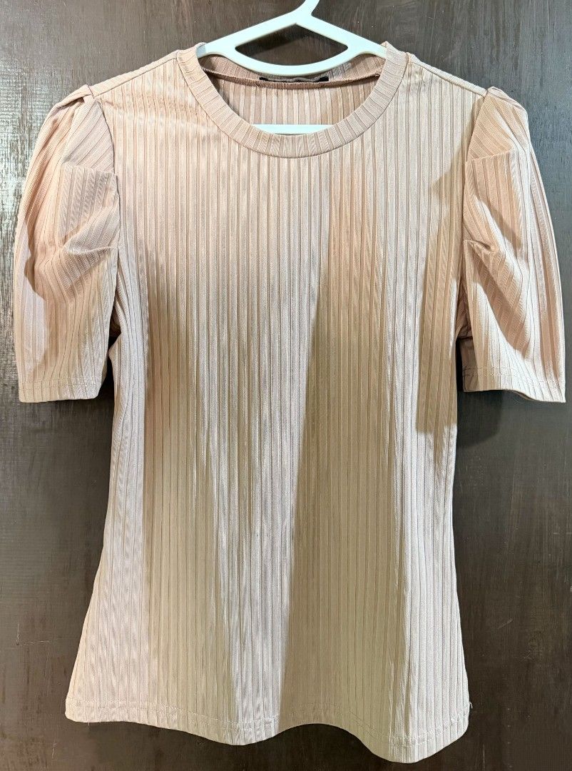 Lovito Ribbed Puff Sleeve Top Nude Beige (Category: Blouses) located in Taguig. Submitted by chicstyle (Listing ID 1470634864, Image 1). Description: - Color: Nude beige - Style: Ribbed knit top with short puff sleeves and round neckline - Material: Stretchy and comfortable fabric - Versatility: Easy to match with jeans or skirts for daily wear - Condition: Brand new / Excellent.