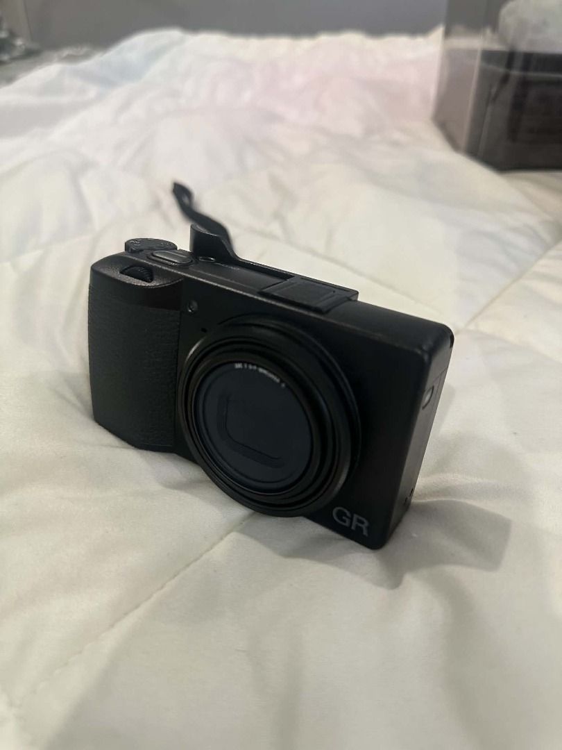 Ricoh GR III HDF (Category: Cameras) located in Cavite. Submitted by sychino (Listing ID 1470597694, Image 2). Description: Inclusions: - Leather Camera Bag (worth P200) - JJC Thumb Grip (worth P580) - Camera Dry Box (worth P820) - JJC Lens Protector (worth P1.1k installed) - JJC USB Multi Battery Charger (worth P1k) - JJC Extra Battery (worth P900) - Sandisk ExtremePro SD Card (worth P4k) - with Receipt and Box - Shutter Count: 3900 - Bought Oct
