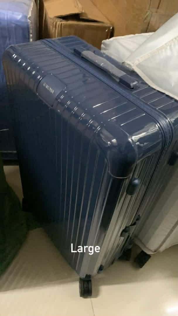Rimowa Large Suitcase (Category: Luggage) located in Caloocan City. Submitted by melissajto31605 (Listing ID 1470683315, Image 2). Description: - Brand: Rimowa Large Suitcase - Colors available: White, Blue, Orange, and Purple - Exterior: Durable hard shell with iconic grooved design for ultimate protection - Mobility: Sturdy multi-wheel setup for smooth gliding - Interior: Spacious capacity designed for long trips and heavy packing - Features: S