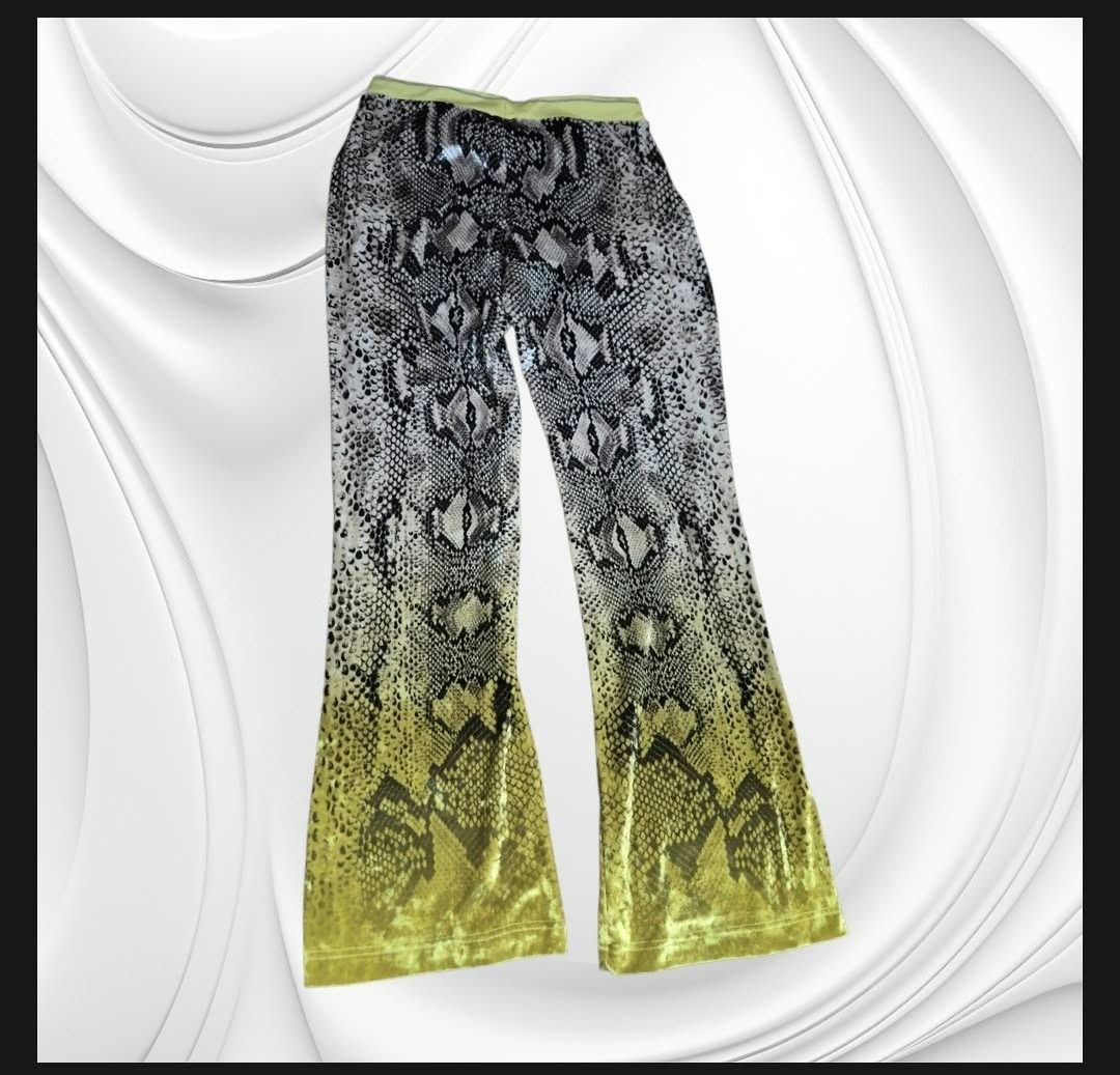 Roberto Cavalli Gym Python Print Track Pants Yellow (Category: Activewear) located in Paranaque City. Submitted by calm_youngstore7 (Listing ID 1470620646, Image 3). Description: LAST PIECE SALE! 80% OFF RETAIL - Brand: Roberto Cavalli - Condition: Brand new with original store tags attached - Design: All-over python snakeskin pattern with a neon yellow ombré gradient towards the bottom - Waistband: Chartreuse yellow elastic with metallic silver 