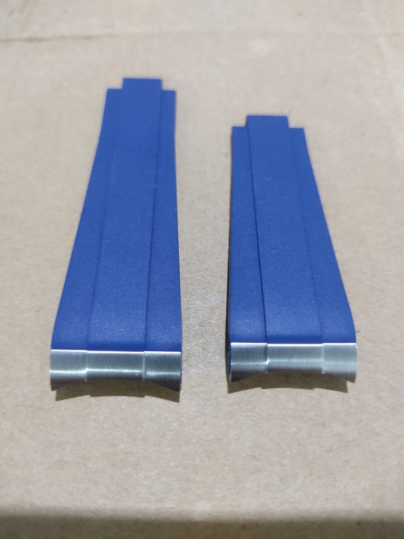 Rolex Blue Rubber Watch Strap E and F (Category: Men's Watches) located in Manila. Submitted by honeyrox (Listing ID 1470693300, Image 2). Description: - Genuine Rolex blue rubber watch strap sections (marked E and F) - Includes integrated metal end links for seamless attachment - Distinctive textured surface with stylish molded center ridges - Official Rolex branding embossed near the buckle ends - Ideal standard replacement parts for compatible