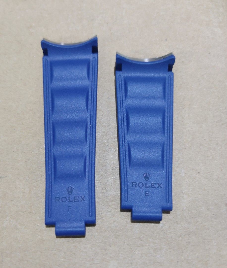 Rolex Blue Rubber Watch Strap E and F (Category: Men's Watches) located in Manila. Submitted by honeyrox (Listing ID 1470693300, Image 3). Description: - Genuine Rolex blue rubber watch strap sections (marked E and F) - Includes integrated metal end links for seamless attachment - Distinctive textured surface with stylish molded center ridges - Official Rolex branding embossed near the buckle ends - Ideal standard replacement parts for compatible