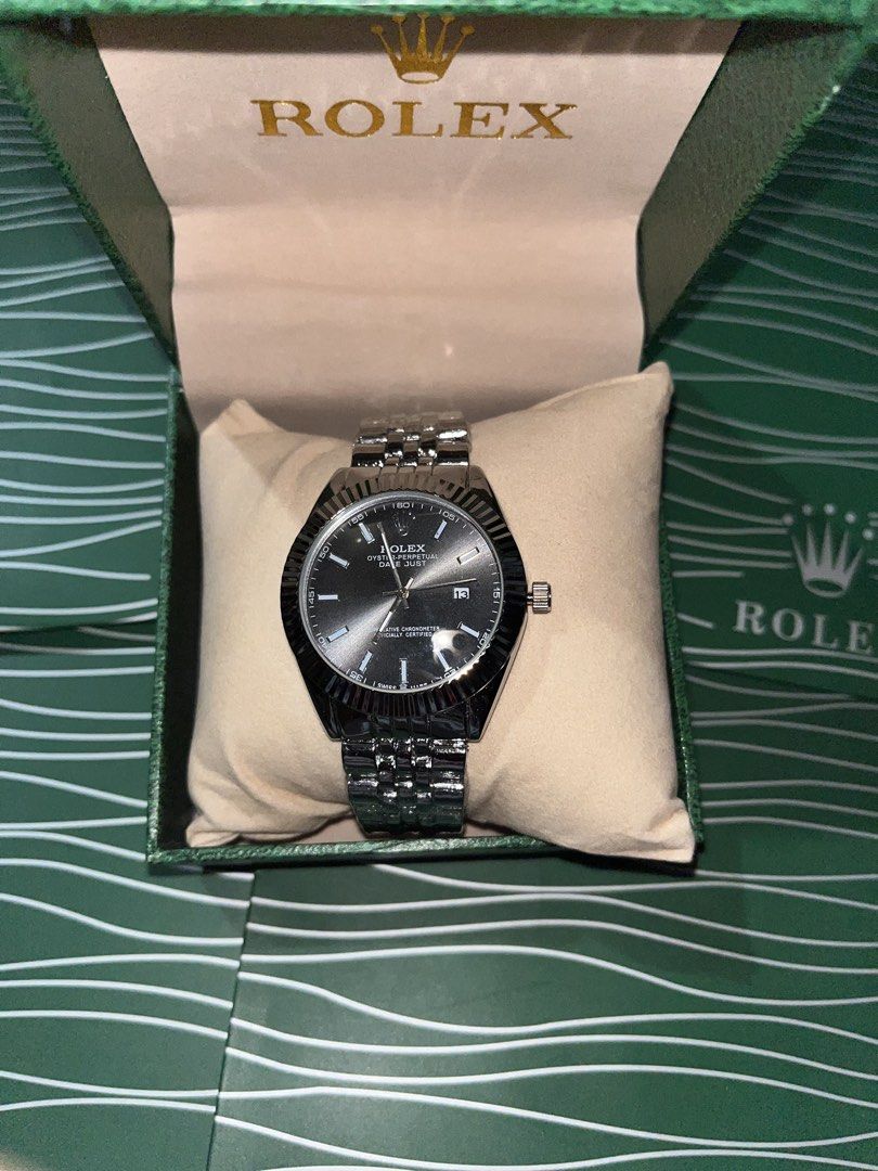 Rolex Datejust Watch with Green Box (Category: Luxury Watches) located in Manila. Submitted by barditss (Listing ID 1470660525, Image 1). Description: - Sleek black sunburst dial with date window and cyclops lens at 3 o'clock - Iconic 18k white gold fluted bezel - Comfortable and classic stainless steel jubilee bracelet - Includes original green Rolex presentation box with gold logo - Meet-ups preferred or insured shipping available across the Ph