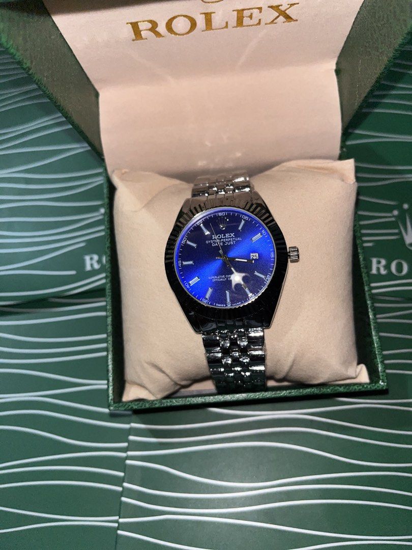 Rolex Oyster Perpetual Datejust Blue Dial Watch (Category: Luxury Watches) located in Manila. Submitted by barditss (Listing ID 1470660676, Image 1). Description: - Authentic Rolex Oyster Perpetual Datejust - Striking blue sunburst dial with silver-tone stainless steel construction - Iconic fluted bezel and comfortable jubilee bracelet - Date window at 3 o'clock with cyclops lens magnifier - Includes official green presentation box with cushion -