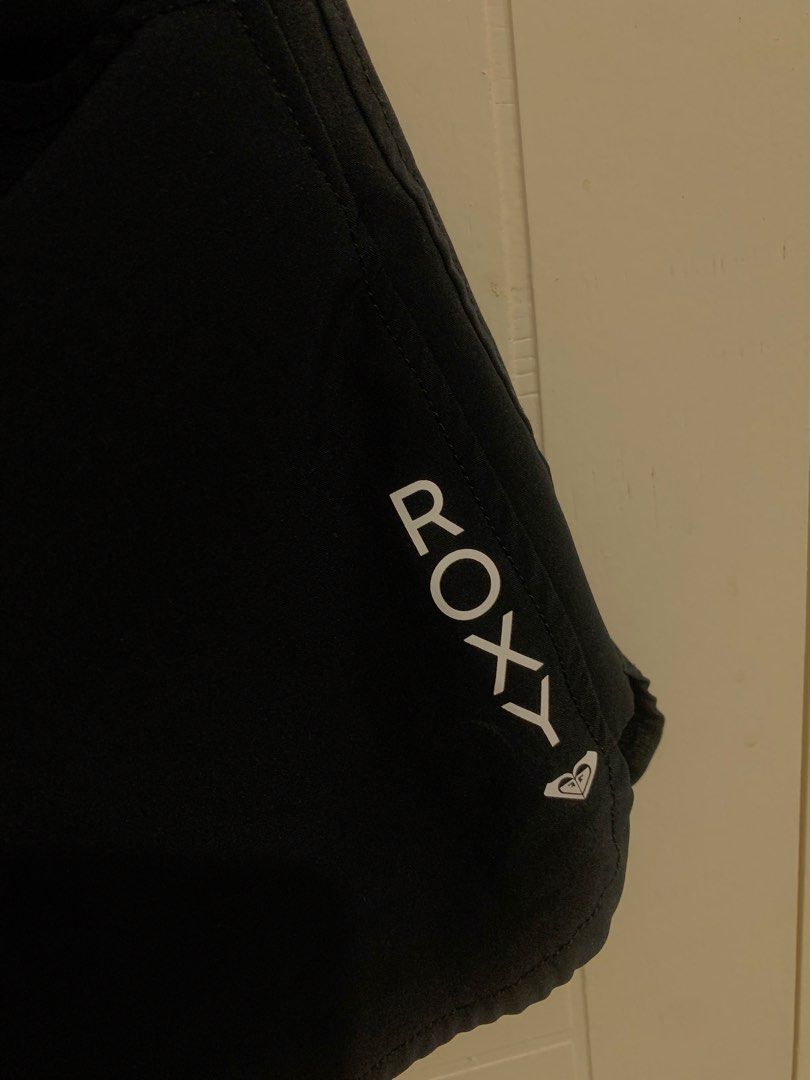 Roxy Black Athletic Board Shorts Size XS (Category: Shorts) located in Pasig City. Submitted by lovedbyri (Listing ID 1470703957, Image 2). Description: - Brand: Roxy - Color: Black - Material: 92% polyester, 8% elastane (lightweight fabric) - Features: Elastic waistband with adjustable drawstring, two side pockets, and small white vertical Roxy logo on the left leg - Condition: Clean inside and out, ready to wear.