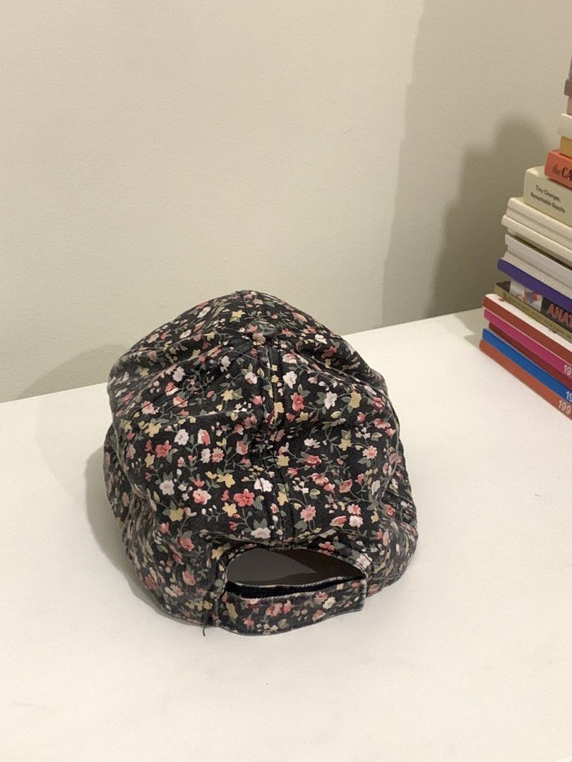 Rubi Floral Print Baseball Cap (Category: Caps & Hats) located in Pasig City. Submitted by lovedbyri (Listing ID 1470701523, Image 3). Description: - Brand: Rubi - Design: Stunning all-over floral print on a dark background - Fit: Classic curved brim with an adjustable strap closure at the back - Interior: Structured paneling with official Rubi brand label - Perfect for everyday casual wear and sunny days out!.