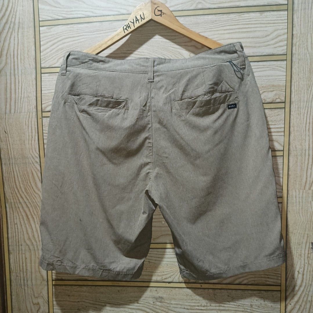 RVCA 4-Way Performance Stretch Shorts Khaki Size 32-33 (Category: Shorts) located in Narra. Submitted by rhyanguan63087 (Listing ID 1470571406, Image 3). Description: - Brand: RVCA - Color: Khaki Heather - Size: 32 waistband with button closure - Material: 4-way performance stretch fabric for maximum mobility - Pockets: Two front pockets and two back welt pockets with RVCA label - Details: Small loop detail on the back waist - Condition: Clean in