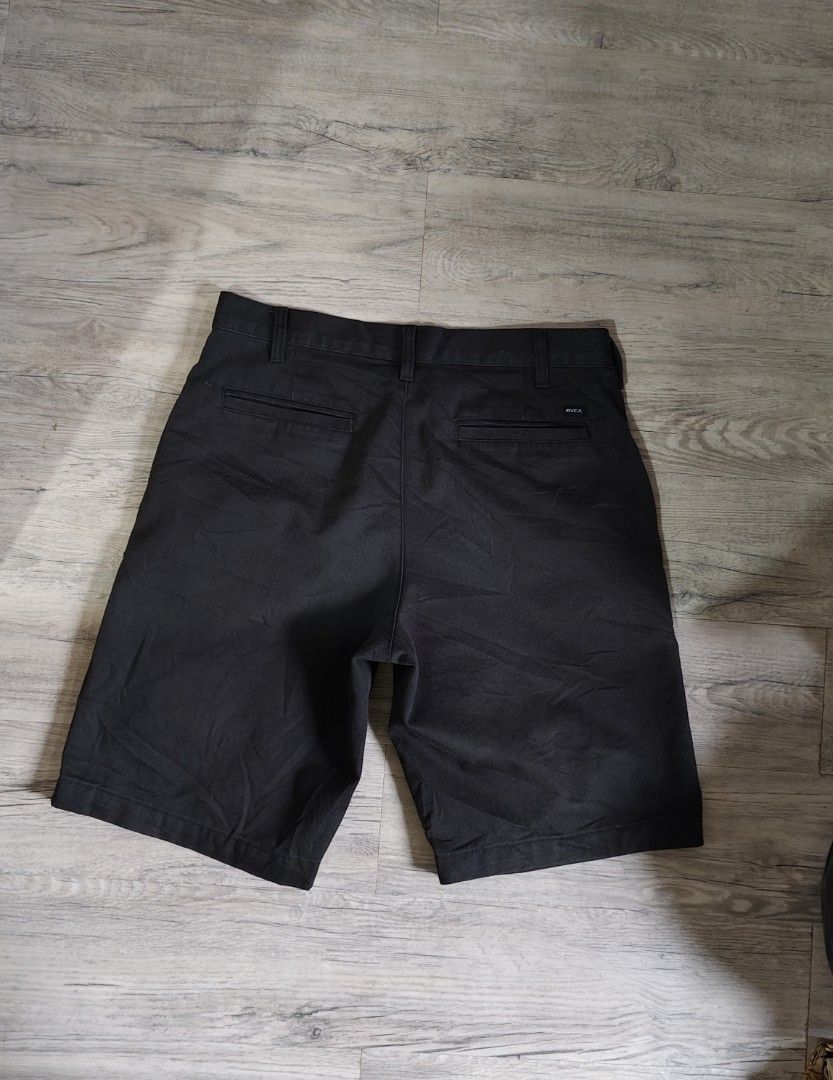 RVCA Americana Black Shorts Size 32 (Category: Shorts) located in Quezon City. Submitted by truedeer_cda94c (Listing ID 1470602449, Image 2). Description: - Brand: RVCA (Americana Style) - Color: Black - Size: 32 Waist - Material/Origin: Made in Sri Lanka - Features: Classic chino style, button closure, zip fly - Pockets: Dual front pockets, coin pocket with embroidered logo, dual welt back pockets with RVCA tag - Condition: Clean, solid pair, re