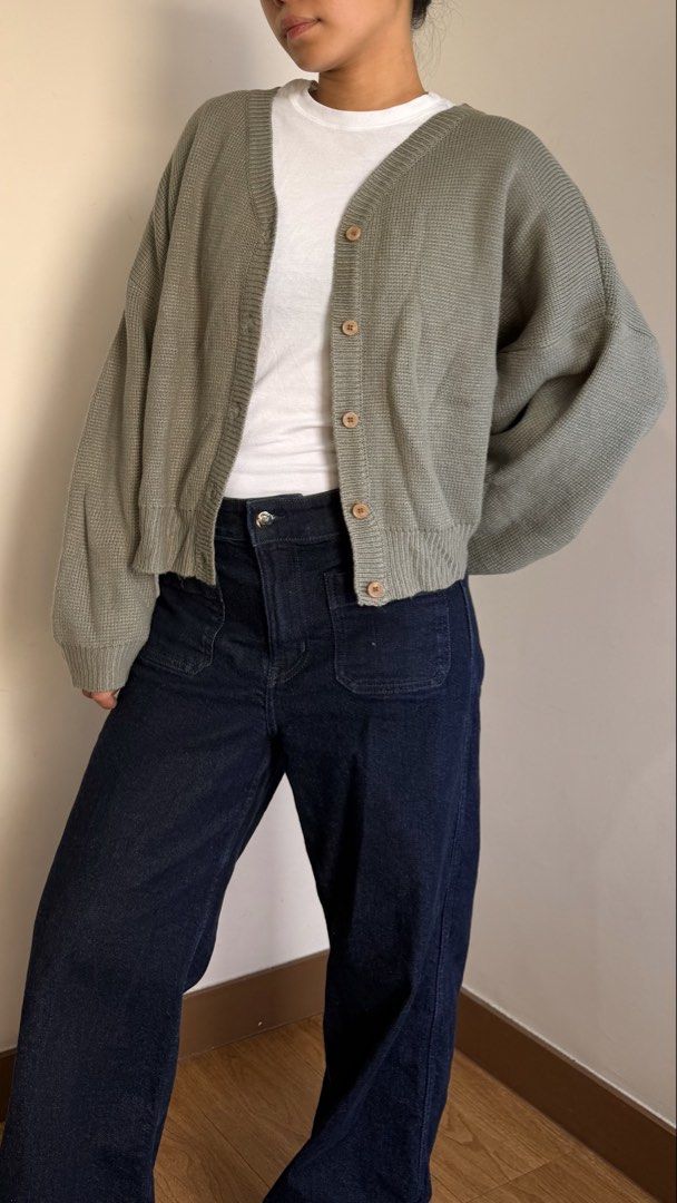 Sage Green Knit Cardigan Preloved Size Medium (Category: Coats, Jackets and Outerwear) located in Quezon City. Submitted by cristealyanna (Listing ID 1470563973, Image 2). Description: - Color: Sage green - Size : Medium - Style: Relaxed fit, button-up cardigan with neutral brown buttons - Features: Long sleeves, ribbed cuffs and hem, soft textured knit material - Perfect for layering over basic tees.
