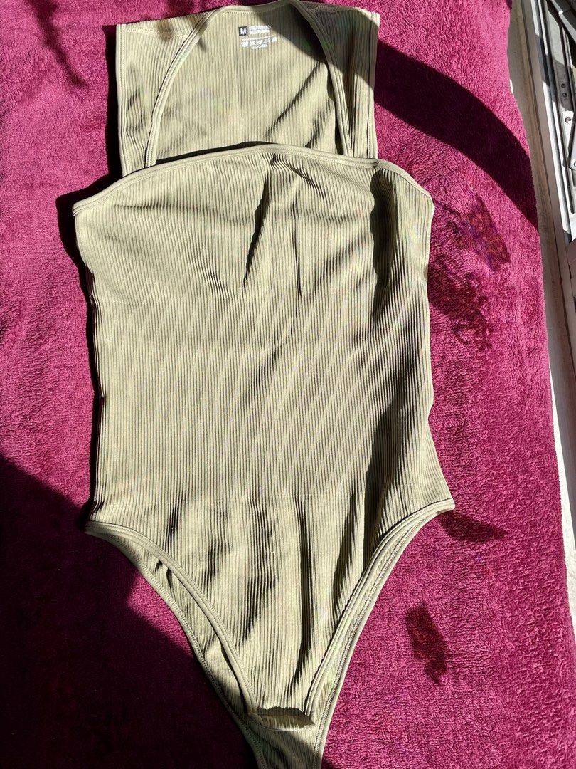 Sage green ribbed halter bodysuit size M (Category: Sleeveless) located in Manila. Submitted by nicache (Listing ID 1470609370, Image 1). Description: - Color: Sage green - Style: Halter neck with straight front neckline - Material: 90% polyamide, 10% elastane - Size: M (tag attached) - Fabric: Soft and stretchy ribbed knit - Condition: Clean and ready to wear.