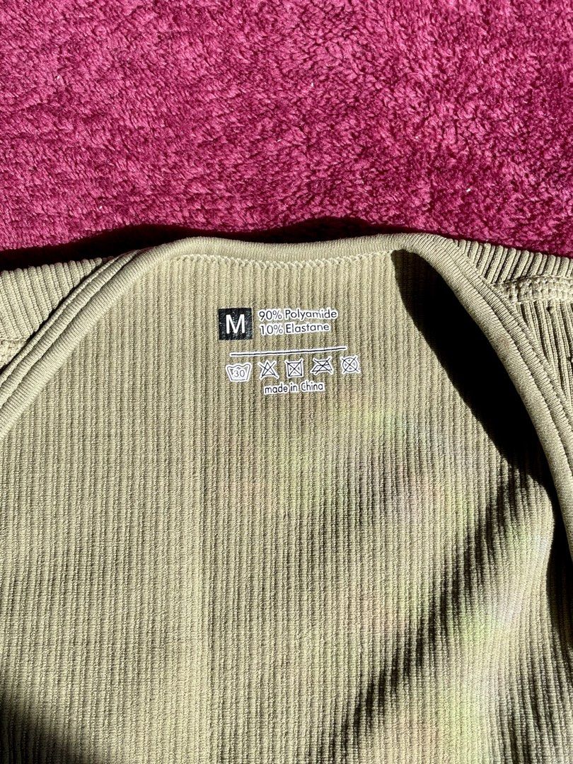 Sage green ribbed halter bodysuit size M (Category: Sleeveless) located in Manila. Submitted by nicache (Listing ID 1470609370, Image 3). Description: - Color: Sage green - Style: Halter neck with straight front neckline - Material: 90% polyamide, 10% elastane - Size: M (tag attached) - Fabric: Soft and stretchy ribbed knit - Condition: Clean and ready to wear.