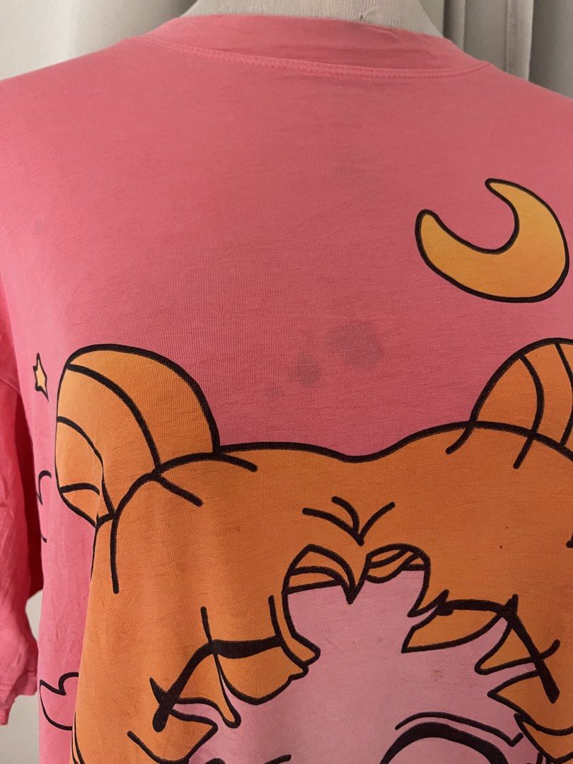 Sailor Moon Pink Oversized Graphic T-Shirt (Category: Shirts) located in Cainta. Submitted by zlove111 (Listing ID 1470707618, Image 3). Description: - Color: Bright pink - Design: Chibi Sailor Moon graphic with yellow crescent moon - Fit: Oversized / relaxed fit - Style: Short sleeves, crew neckline - Flaw: Small faint smudge near the collar between the hair buns (check close-up photo) cute. selling low, may dirt:light stain. no other issue up t