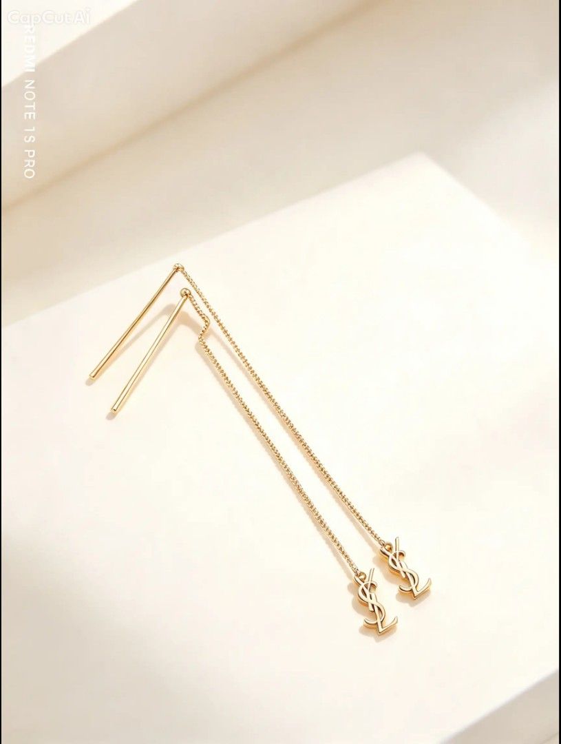 Saint Laurent Opyum Threader Metal Earrings (Category: Earrings) located in Naguilian. Submitted by jhoyukay (Listing ID 1470687237, Image 3). Description: - Brand: Saint Laurent (YSL) - Style: Opyum threader earrings with chain link design and straight metal post - Finish: Pink gold with iconic YSL monogram dangling charm - Condition: Brand new, never worn, pristine condition - Inclusions: Original black brand box and tags included.