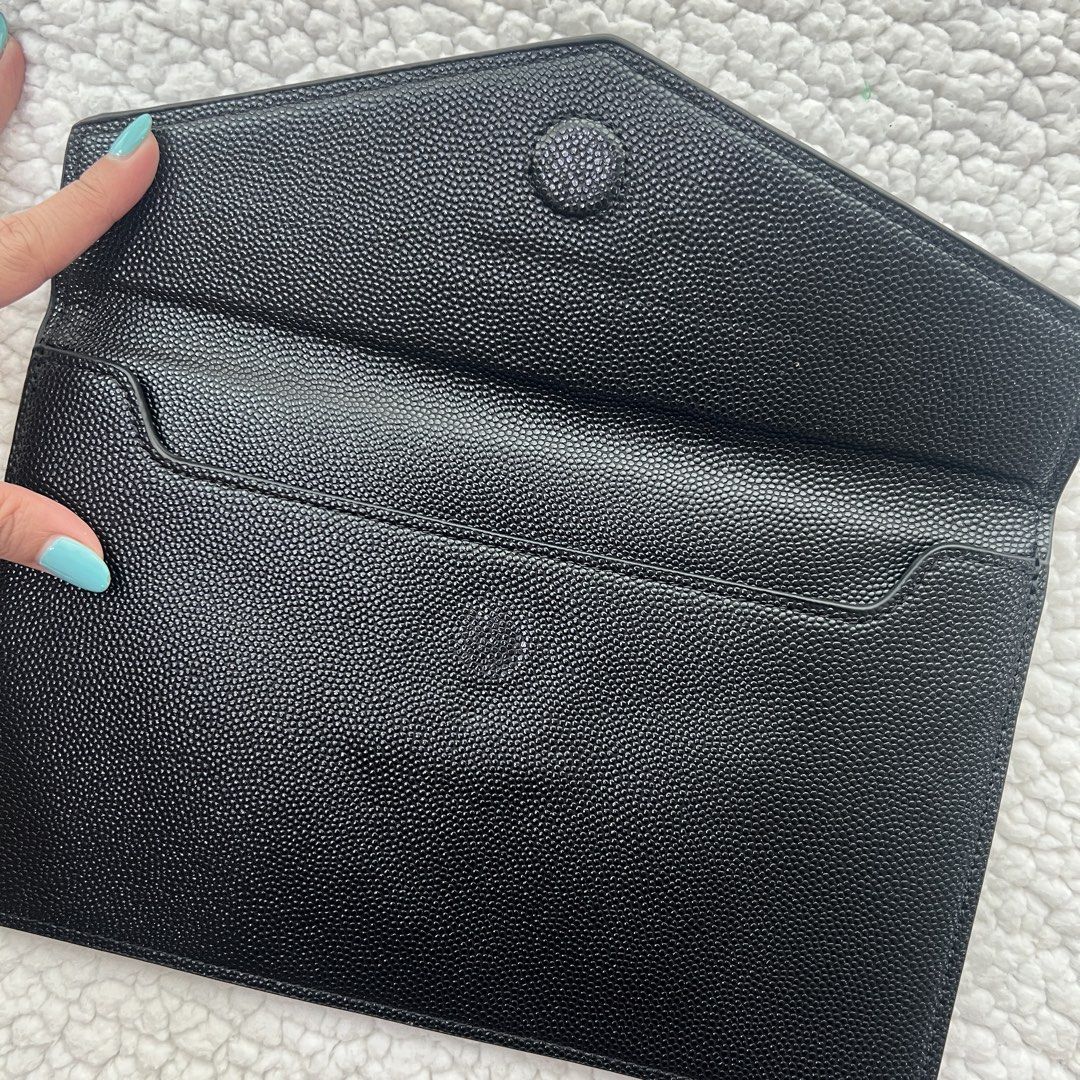 Saint Laurent YSL Clutch Bag (Category: Luxury Bags & Wallets) located in Manila. Submitted by nadascloset09 (Listing ID 1470732801, Image 2). Description: ✨ Brand‑new premium copy — perfect for special events or gifting this Christmas ✨ - Brand: Saint Laurent (YSL) - Model: Uptown Pouch / Clutch - Color: Classic Black with Gold Hardware - Material: Textured Calfskin Leather - Dimensions: Approx. 11 x 6.5 inches - Closure: Flap with magnetic snap