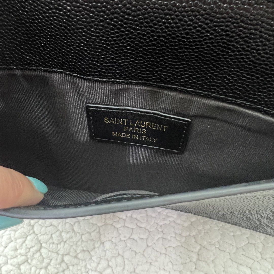 Saint Laurent YSL Clutch Bag (Category: Luxury Bags & Wallets) located in Manila. Submitted by nadascloset09 (Listing ID 1470732801, Image 3). Description: ✨ Brand‑new premium copy — perfect for special events or gifting this Christmas ✨ - Brand: Saint Laurent (YSL) - Model: Uptown Pouch / Clutch - Color: Classic Black with Gold Hardware - Material: Textured Calfskin Leather - Dimensions: Approx. 11 x 6.5 inches - Closure: Flap with magnetic snap