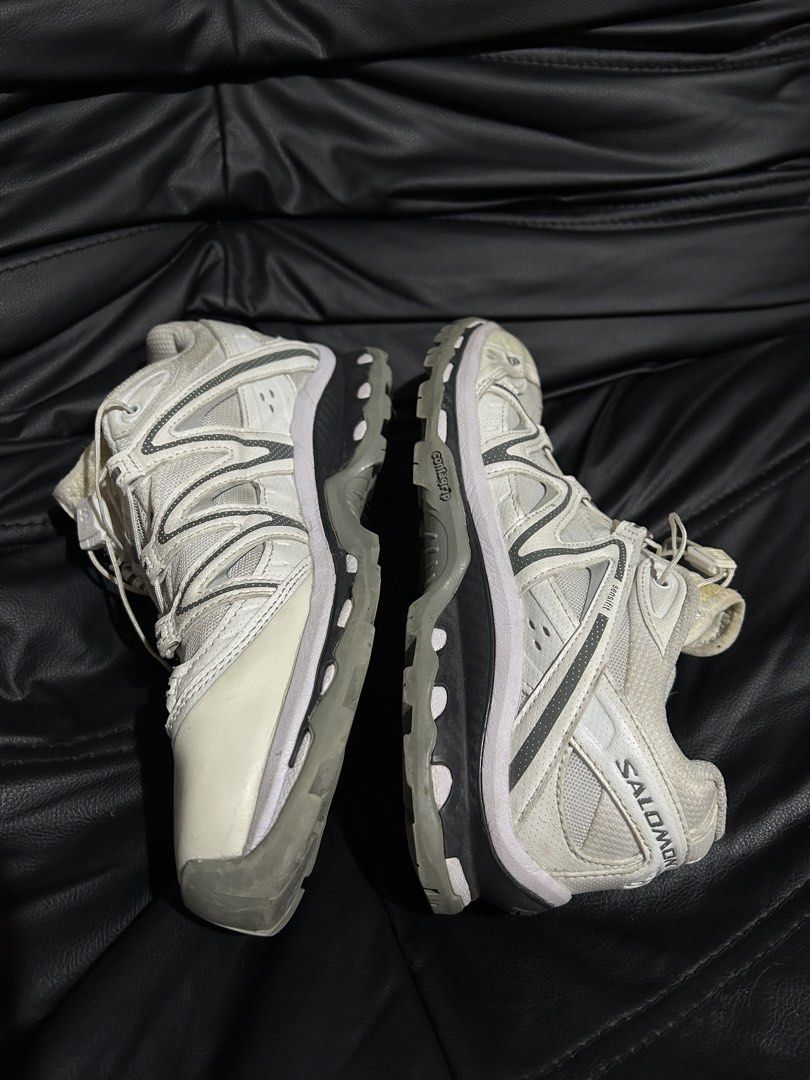 Salomon XT-Quest Sneakers White Grey (Category: Sneakers) located in Manila. Submitted by drilskie0954204 (Listing ID 1470667032, Image 1). Description: - Brand: Salomon - Model: XT-Quest - Colorway: White and Grey - Style: Chunky gorpcore aesthetic - Features: Quicklace system, Sensifit technology, Contagrip rubber sole - Condition: Uppers are clean, soles show minor dirt from normal wear.