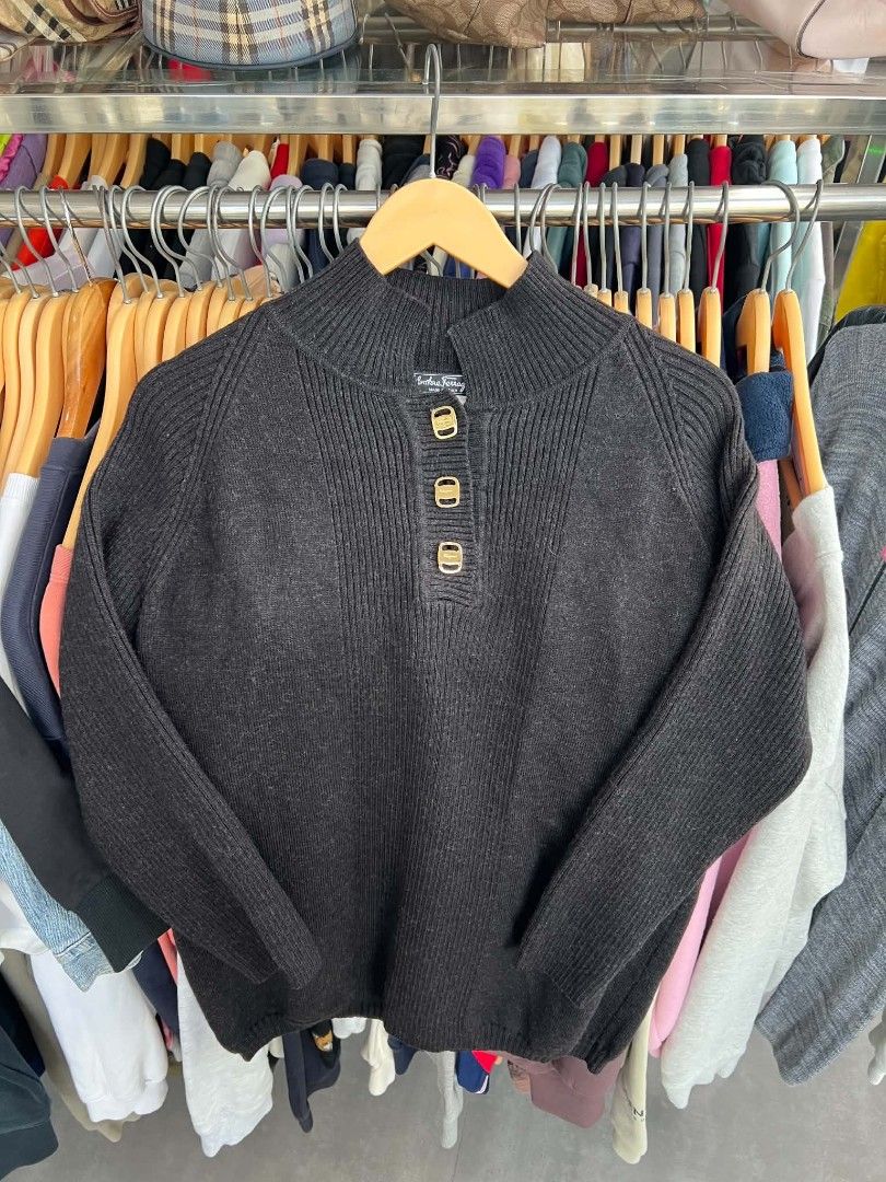 Salvatore Ferragamo Wool Mock Neck Sweater (Category: Coats, Jackets and Outerwear) located in Urdaneta. Submitted by jayceegarage (Listing ID 1470691854, Image 1). Description: - Brand: Salvatore Ferragamo - Color: Black - Size: Medium (M) - Material: 100% Virgin Wool (Made in Italy) - Design: High mock neck with 3 gold-tone front buttons, long sleeves, and all-over ribbed knit texture - Condition: Excellent, warm and comfortable for chilly weat