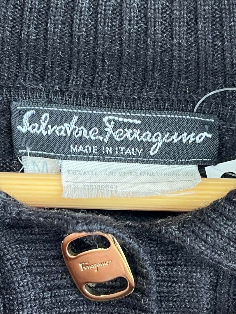 Salvatore Ferragamo Wool Mock Neck Sweater (Category: Coats, Jackets and Outerwear) located in Urdaneta. Submitted by jayceegarage (Listing ID 1470691854, Image 3). Description: - Brand: Salvatore Ferragamo - Color: Black - Size: Medium (M) - Material: 100% Virgin Wool (Made in Italy) - Design: High mock neck with 3 gold-tone front buttons, long sleeves, and all-over ribbed knit texture - Condition: Excellent, warm and comfortable for chilly weat