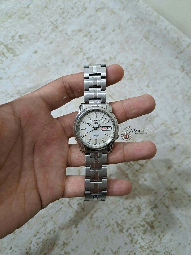Seiko 5 Automatic SNKL75K1 (Category: Men's Watches) located in Manila. Submitted by lucio26 (Listing ID 1470733114, Image 3). Description: 🔥 Seiko 5 Automatic Silver Dial SNKL75K1 | 7S26-03S0 📌 DETAILS • Model: Seiko 5 SNKL75K1 • Case Code: 7S26-03S0 • Serial Number: 8D1817 • Movement: Seiko Cal. 7S26 Automatic • Jewels: 21 • Case Size: Approx. 37-38mm • Dial: Silver-white dial with applied hour indices and an outer minute track • Hands & Hour