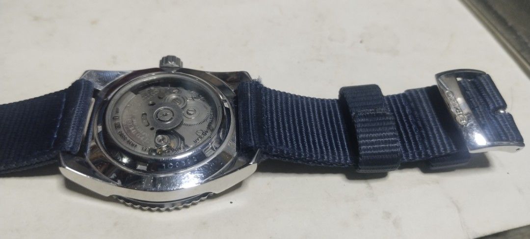 Seiko Automatic Diver's 200m Watch Pepsi Bezel (Category: Jewelry) located in Manila. Submitted by olxph_410657706 (Listing ID 1470714837, Image 2). Description: - Brand/Model: Seiko Automatic Diver Watch - Dial: White textured dial with a blue and red Pepsi bezel - Movement: Automatic movement with transparent case back - Strap: Blue nylon fabric strap with signed buckle - Condition: Stainless steel case has minor hairline scratches; keeps time 