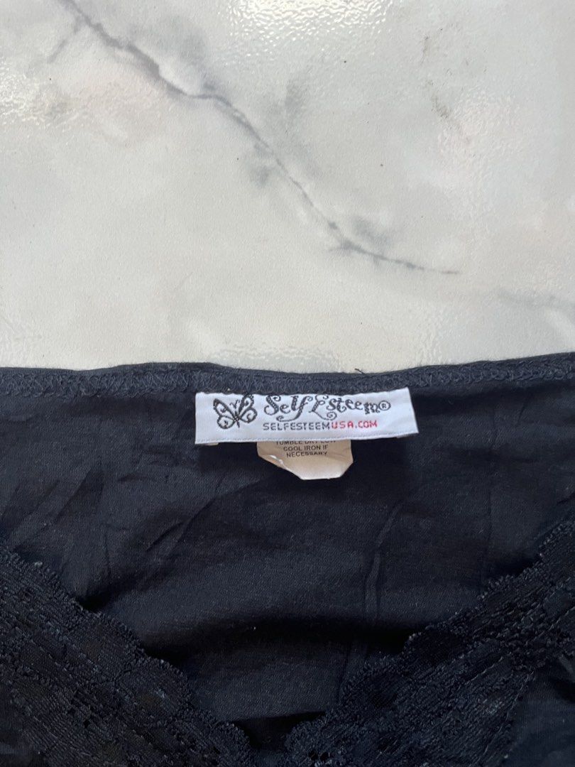 Self Esteem Black Lace Trim Cami Camisole (Category: Sleeveless) located in Caloocan City. Submitted by kimronnel (Listing ID 1470579826, Image 2). Description: - Brand: Self Esteem - Color: Black - Material: Soft cotton blend - Design: V-neck with lace trim detailing - Features: Adjustable thin straps - Condition: Excellent basic layering piece or standalone top.