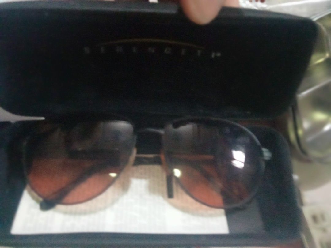 Serengeti Sunglasses with Hard Case (Category: Sunglasses & Eyewear) located in Paranaque City. Submitted by dimaguilaa24827 (Listing ID 1470640289, Image 3). Description: - Brand: Serengeti - Lenses: Premium tinted gradient glass - Frame: Durable metal with solid hinges for a comfortable fit assortedsokd per PC08971752976 - Condition: Ready to wear - Inclusions: Original hard protective case with brand logo - Best for: Driving, outdoor activitie