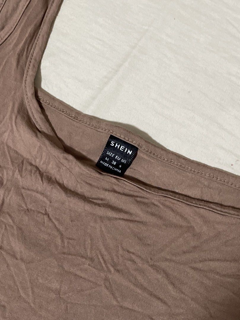SHEIN Brown Square Neck Crop Top Size M (Category: Sleeveless) located in Caloocan City. Submitted by sheshesheshesheshe13 (Listing ID 1470713101, Image 2). Description: - Brand: SHEIN - Color: Brown - Size: M (EUR 38 / US 6) - Design: Square neckline with thick straps - Material: Stretchy, comfortable fabric - Condition: Worn a few times, still in good shape - Style: Great basic piece, easy to pair with high-waisted jeans or skirts.