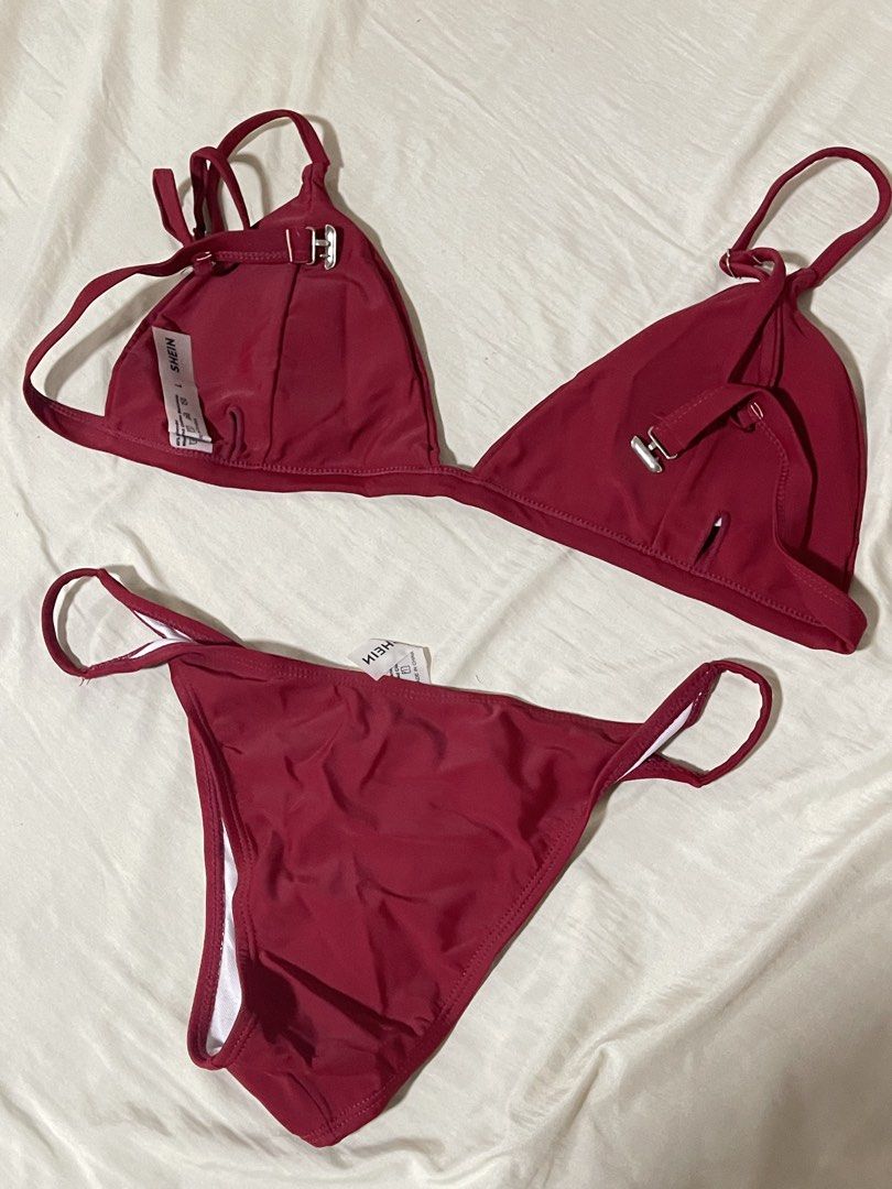 SHEIN Burgundy Triangle Bikini Set Size L (Category: Bikinis & Swimsuits) located in Caloocan City. Submitted by sheshesheshesheshe13 (Listing ID 1470720302, Image 3). Description: - Brand: SHEIN - Color: Burgundy - Size: L (Tag attached) - Condition: Brand new, never worn outdoors (only tried on) - Features: Adjustable straps, side-tie bottoms, and hygiene liner still attached - Material: 80% nylon, 20% spandex.