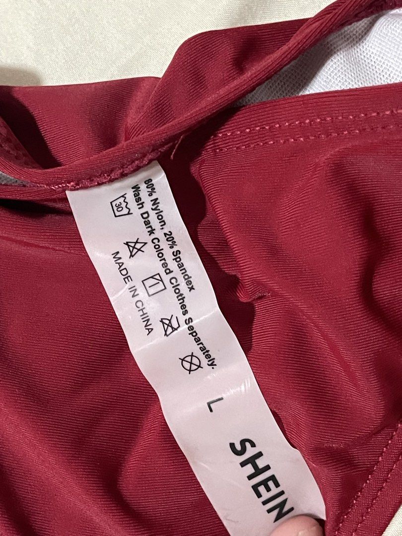 SHEIN Burgundy Triangle Bikini Set Size L (Category: Bikinis & Swimsuits) located in Caloocan City. Submitted by sheshesheshesheshe13 (Listing ID 1470720302, Image 2). Description: - Brand: SHEIN - Color: Burgundy - Size: L (Tag attached) - Condition: Brand new, never worn outdoors (only tried on) - Features: Adjustable straps, side-tie bottoms, and hygiene liner still attached - Material: 80% nylon, 20% spandex.