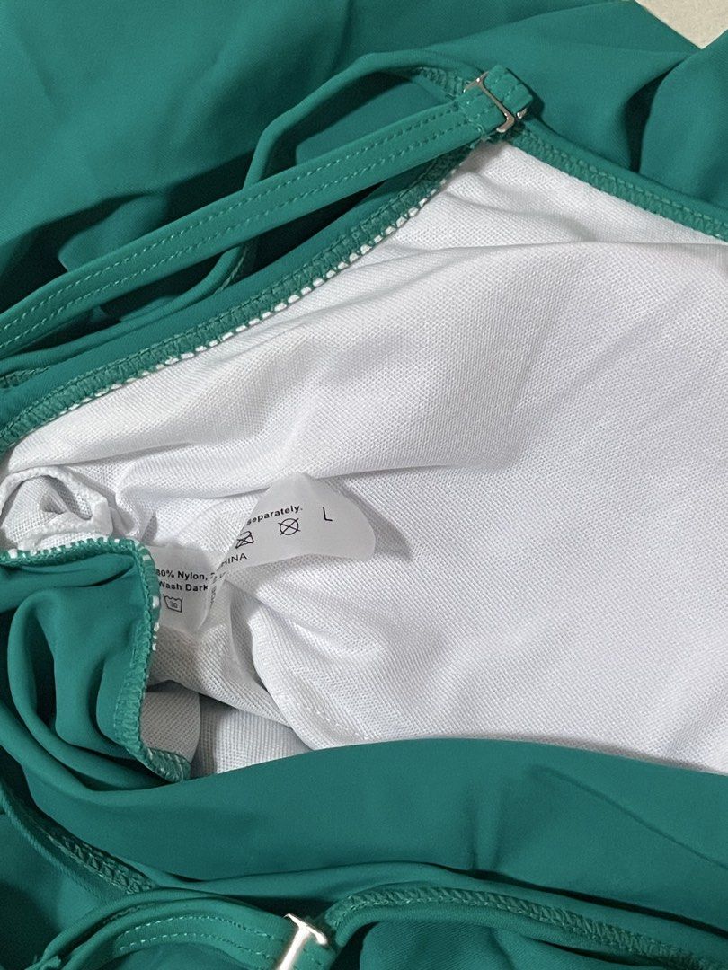 SHEIN Green Ruffle Flounce Bikini Top Size L (Category: Bikinis & Swimsuits) located in Caloocan City. Submitted by sheshesheshesheshe13 (Listing ID 1470720059, Image 3). Description: - Brand: SHEIN - Item: Green bikini top - Size: L (tag attached) - Condition: Brand new with tags (BNWT) - Features: Layered ruffle design, thin adjustable shoulder straps - Material: 80% nylon blend - Care: Hand wash dark colors separately.